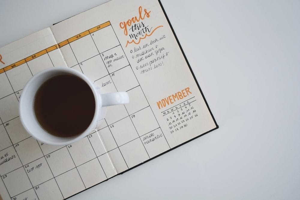 Calendar with cup of coffee