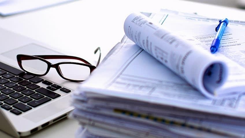 Laptop,paper and glasses