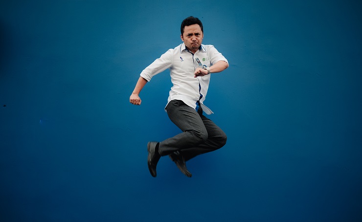 Man jumping with Blue Background