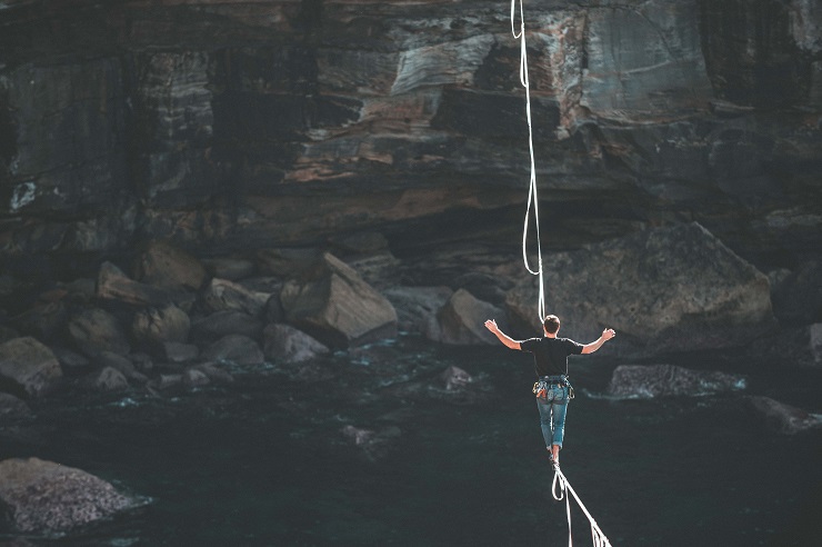 Girl Walking on a rope to take Risk