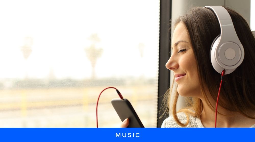 Girl Listening music from a Cellphone